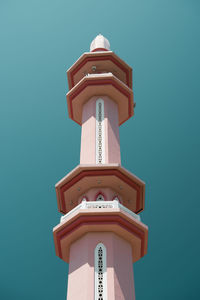 Low angle view of clock tower against clear sky