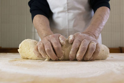 Midsection of person preparing food