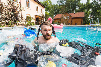 Portrait of man in swimming pool