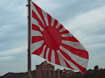 Low angle view of flag against sky