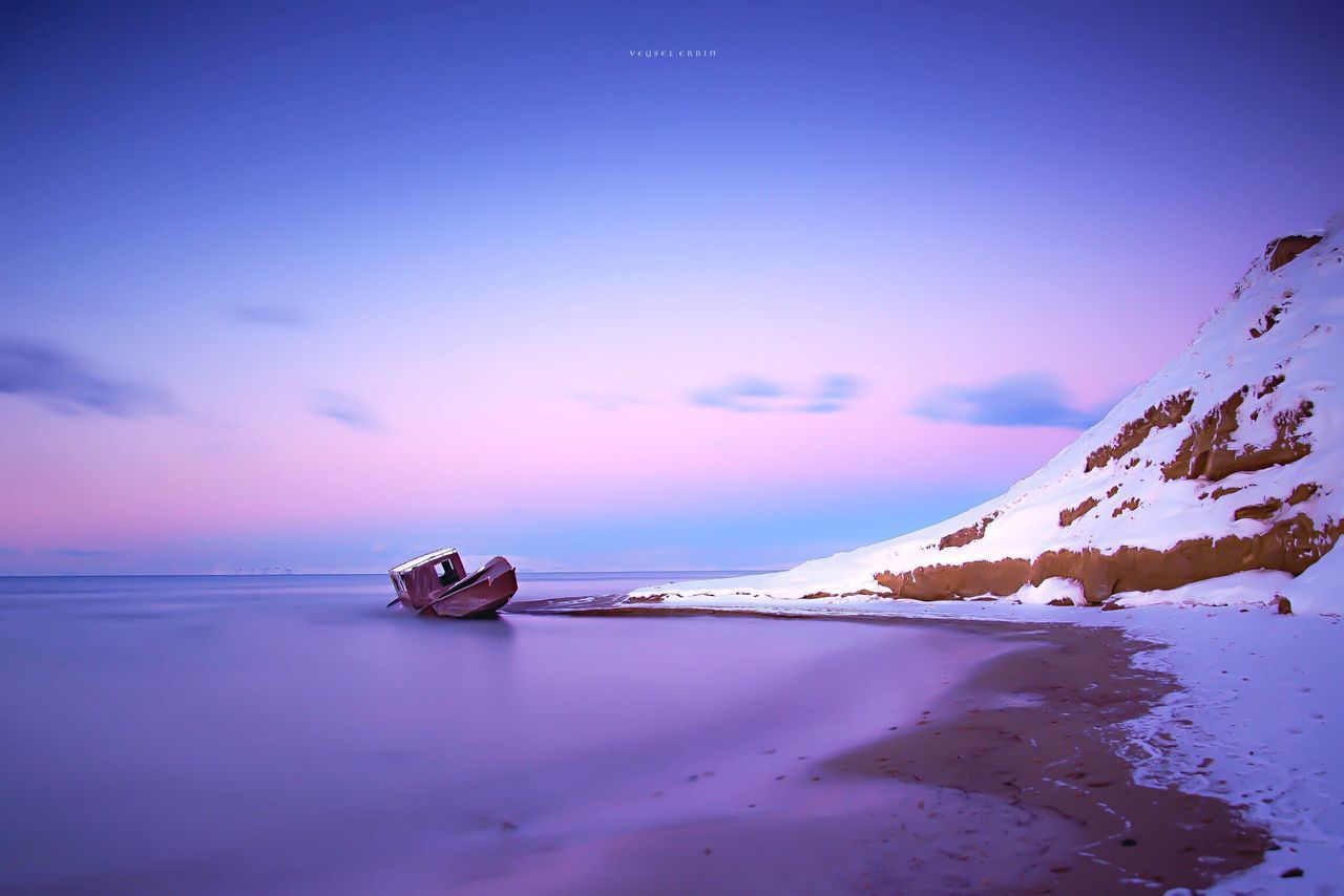 SCENIC VIEW OF SEA DURING WINTER AGAINST SKY