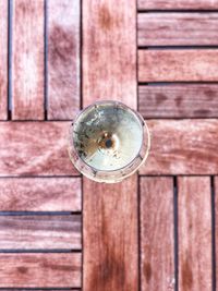 Directly above shot of crystal ball on wooden surface