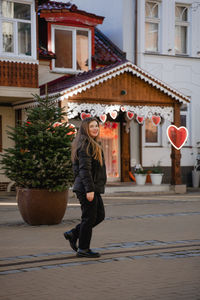 Side view of woman walking on street