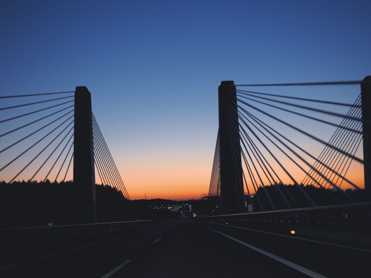 connection, bridge - man made structure, transportation, built structure, suspension bridge, architecture, engineering, outdoors, sky, cable-stayed bridge, road, sunset, bridge, no people, illuminated, day