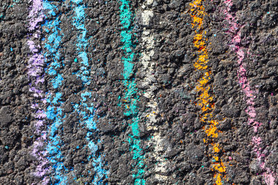 Colored chalk lines on asphalt . abstract chalk drawing