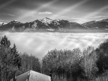 Scenic view of mountains against sky during winter