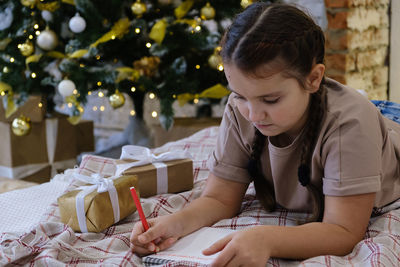 Side view of boy eating food at home