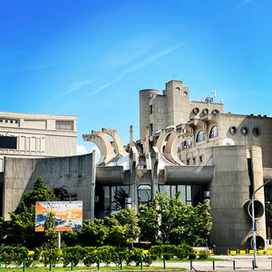 High angle view of buildings against clear blue sky