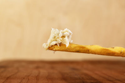 Close up of gorgonzola cheese  on breadstick
