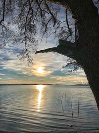 Scenic view of lake against sky during sunset