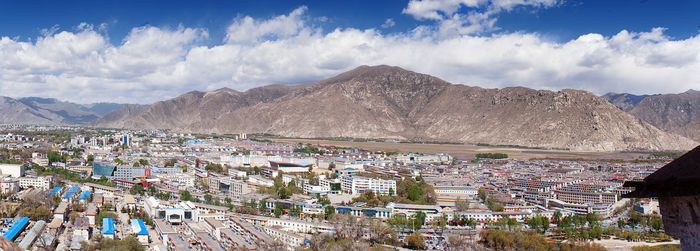 Town against cloudy sky