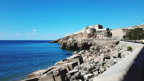 Scenic view of sea against blue sky