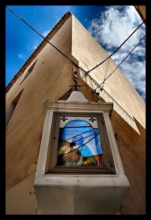 architecture, building exterior, built structure, low angle view, window, transfer print, sky, house, glass - material, blue, auto post production filter, residential structure, day, residential building, door, building, sunlight, no people, cloud, power line