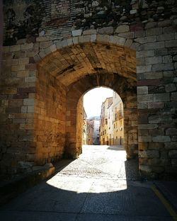 Archway of historic building against sky