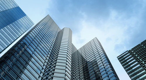 Low angle view of modern buildings against sky