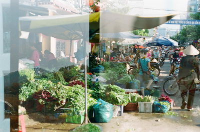 People at market stall in city