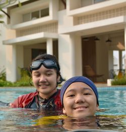 Portrait of smiling boy swimming in pool