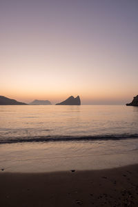 Scenic view of sea against clear sky during sunset