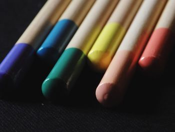 Close-up of colorful pencils on table