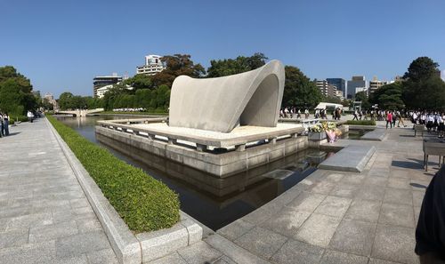 Statue in park against clear blue sky