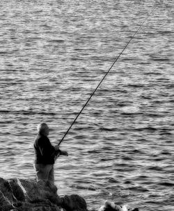 Woman fishing in water