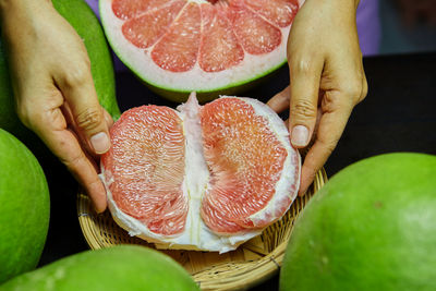Cropped hand of person holding fruit
