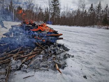 High angle view of bonfire on snow covered land