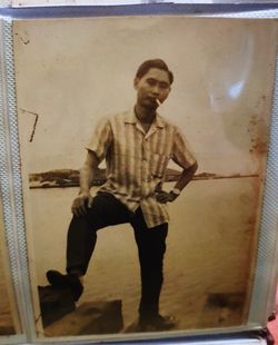 Portrait of man standing by wall