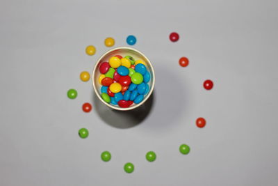 High angle view of multi colored candies on table