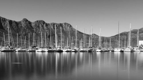 Boats moored at harbor