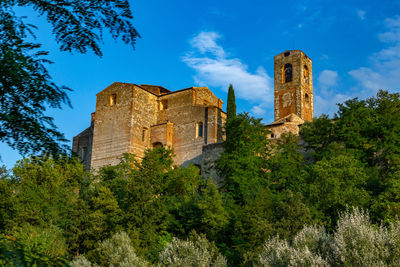 Low angle view of historical building against blue sky