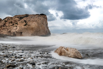 Seascape during stormy weather at the rocky coastal area of the rock of aphrodite in paphos cyprus.