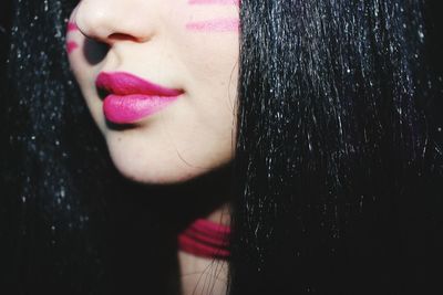 Cropped image of woman with pink lipstick
