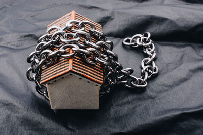 High angle view of metal on bed