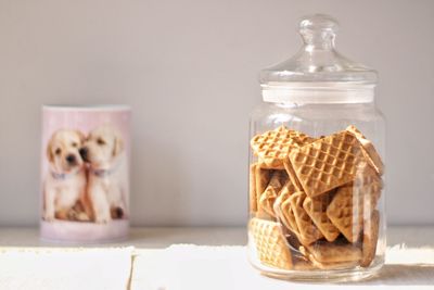 Close-up of a dog on table