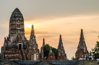 Temple against sky at sunset