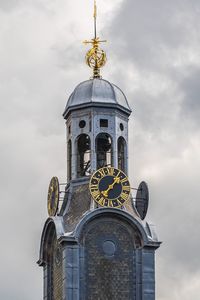 Low angle view of clock tower against sky