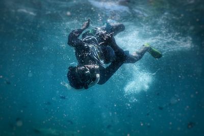 Scuba diver swimming undersea