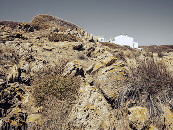 Low angle view of rock formations against sky