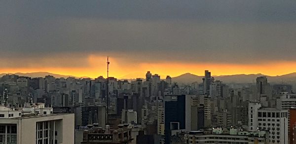 View of cityscape against sky during sunset