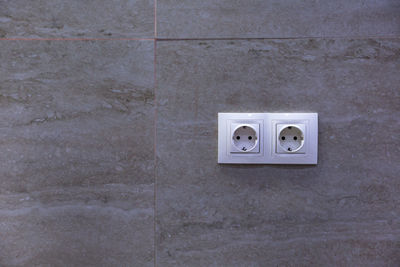Electrical sockets on a stone wall
