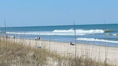 Scenic view of beach against clear sky