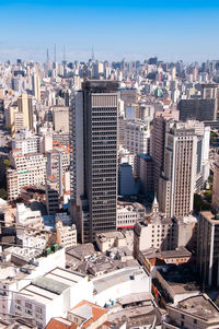 High angle view of modern buildings in city against sky