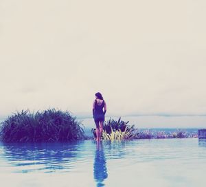 Reflection of woman in water