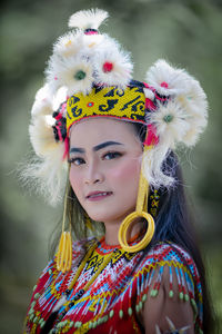 Portrait of young woman wearing fur coat