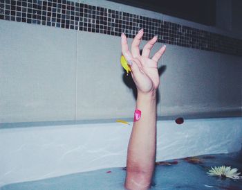 Low section of woman wearing shoes