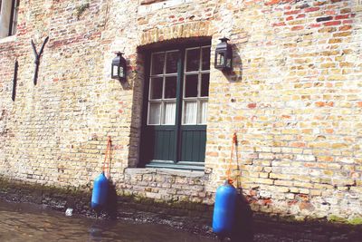 Low section of person on window