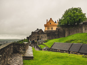 Old building against cloudy sky