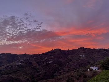 Scenic view of mountains against sky during sunset