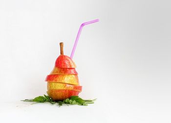 Close-up of fruit against white background